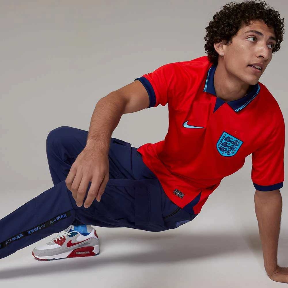 Nike Men's England Dri-Fit Away Stadium Jersey - Challenge Red/Blue Void 1 Nike Men's England Dri-Fit Away Stadium Jersey - Challenge Red/Blue Void